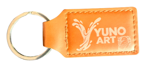 Orange YUNO ART engraved keychain with its metal ring