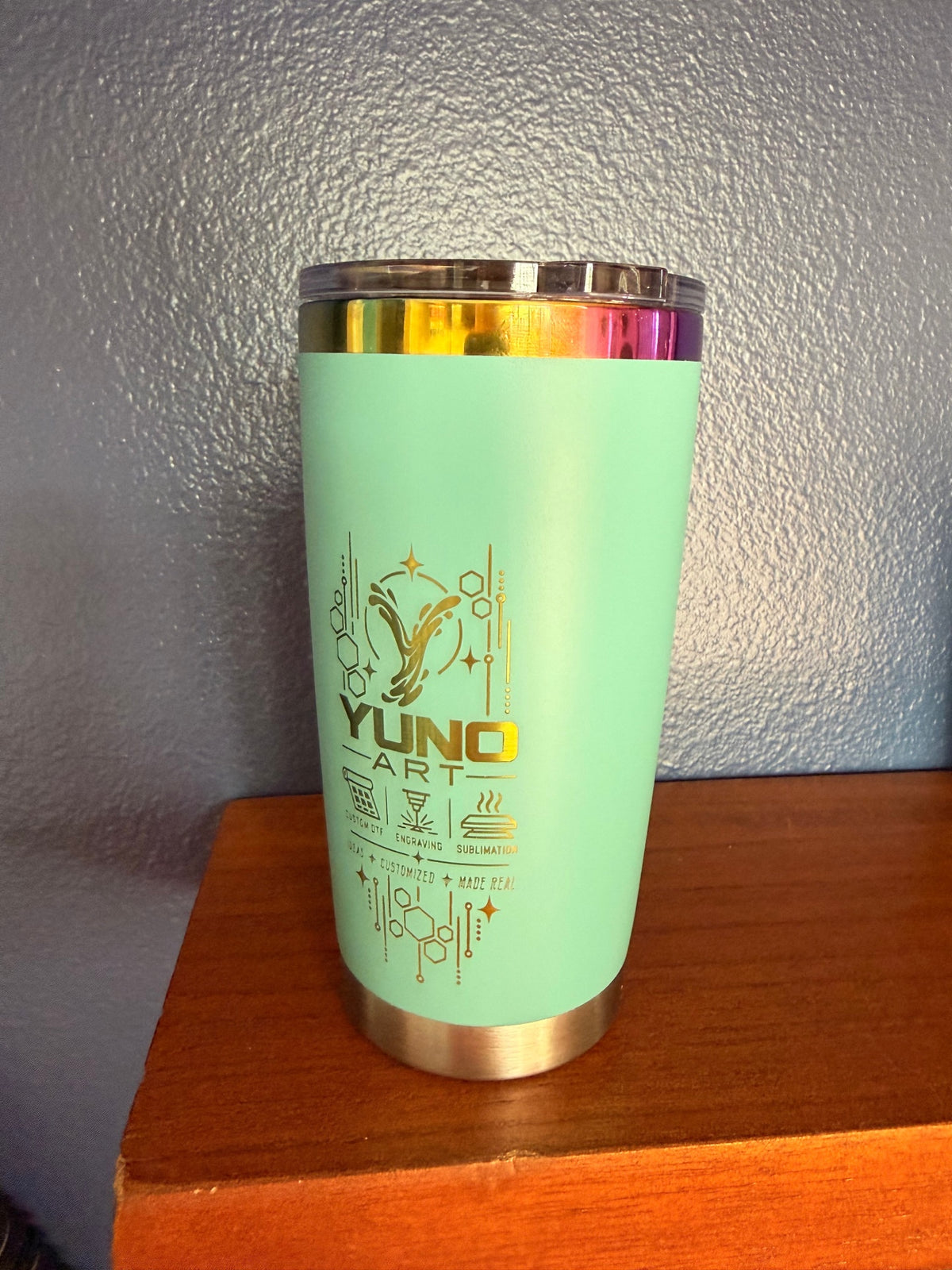 Mint YUNO ART tumbler with an engraved logo